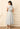 Elegant Draped Blouse and Flowing Paneled Midi Skirt Set
